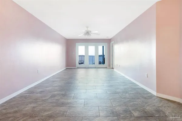 a view of an empty room with glass door