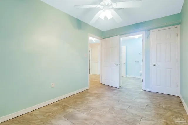 a bathroom with a toilet sink and a mirror