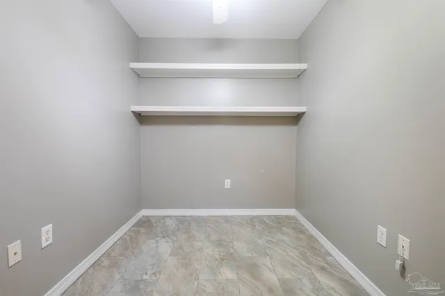 a bathroom with a sink a toilet and vanity