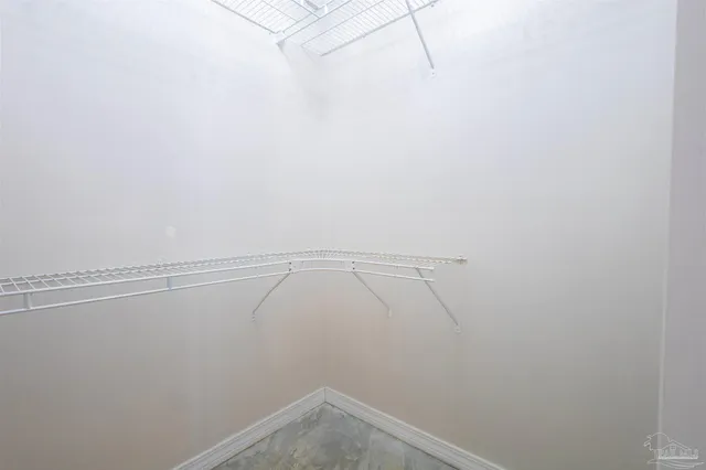 a white toilet sitting next to a shower