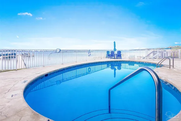 a view of a balcony with two chairs