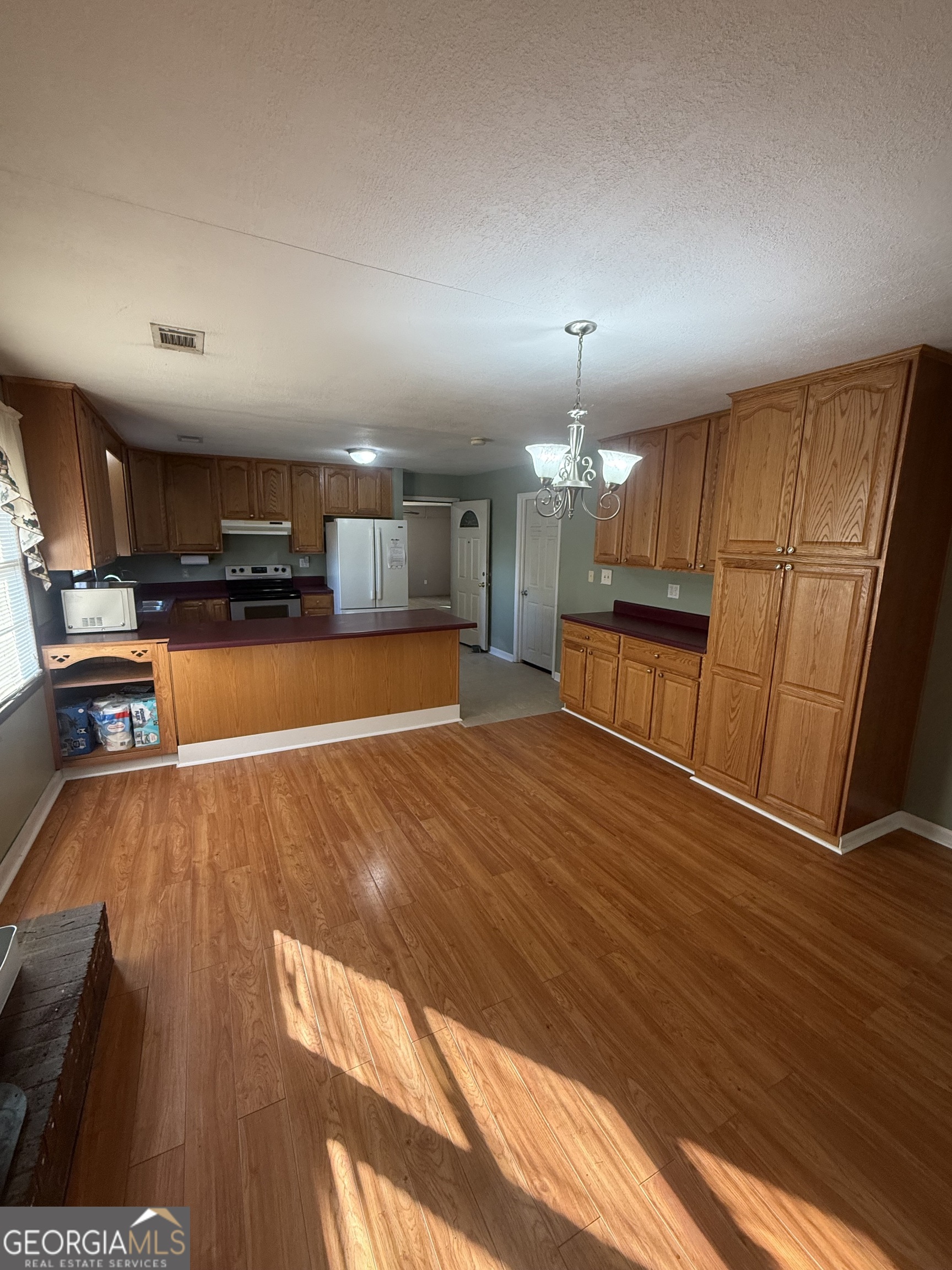 2068 Old Dalton Road Northeast Rome, GA 30165 - Photo 20 of 37 a view of a kitchen with a sink and microwave