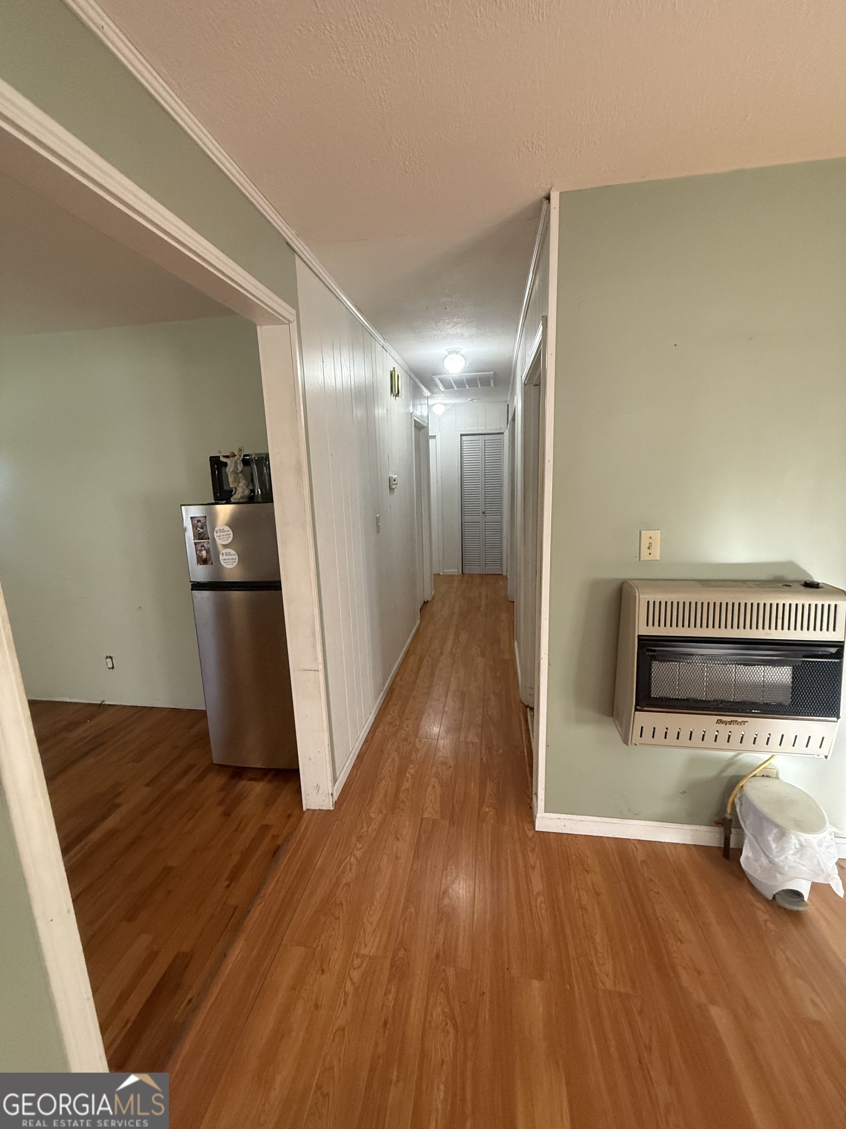 2068 Old Dalton Road Northeast Rome, GA 30165 - Photo 21 of 37 a view of a living room with wooden floor and staircase