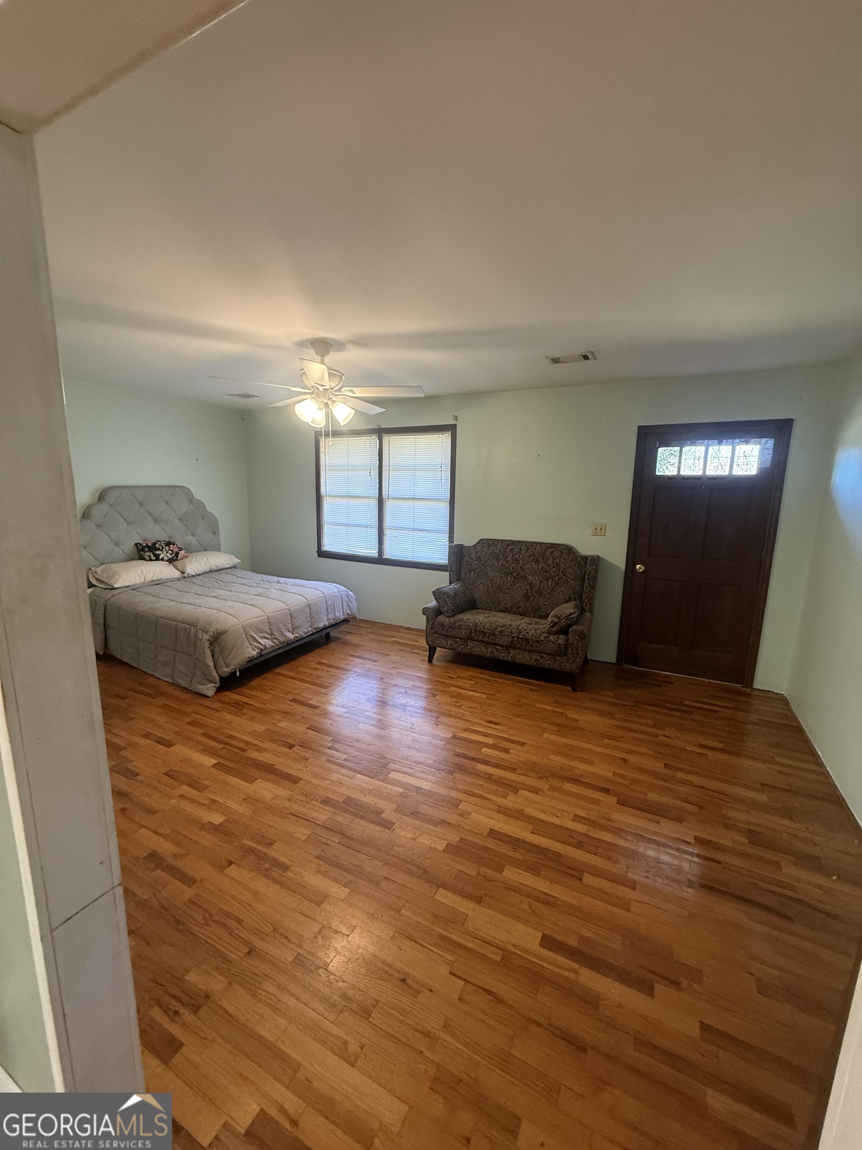 2068 Old Dalton Road Northeast Rome, GA 30165 - Photo 23 of 37 a bedroom with a bed and a large window