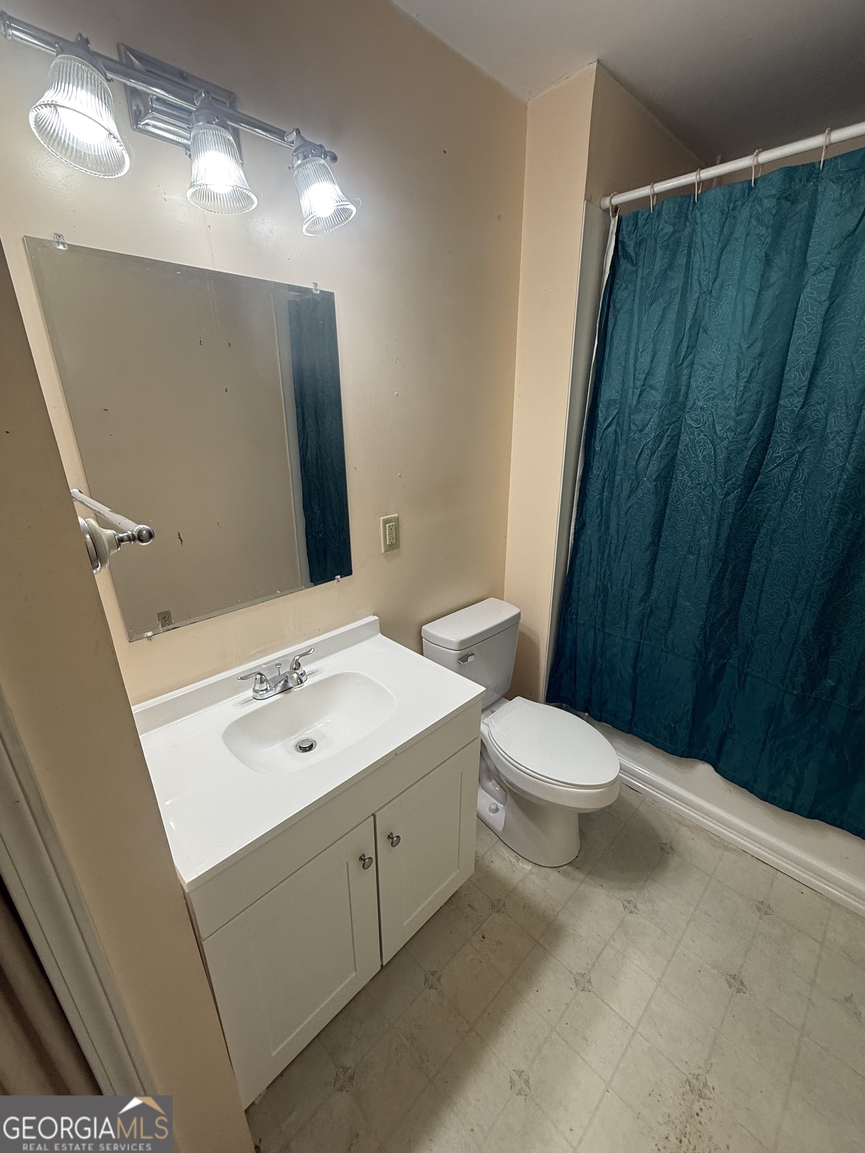 2068 Old Dalton Road Northeast Rome, GA 30165 - Photo 25 of 37 a bathroom with a toilet a sink and a mirror