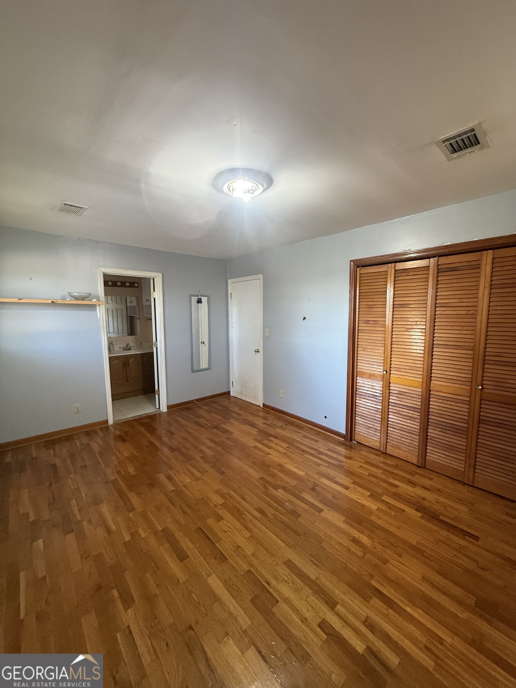 2068 Old Dalton Road Northeast Rome, GA 30165 - Photo 33 of 37 an empty room with windows and cabinet