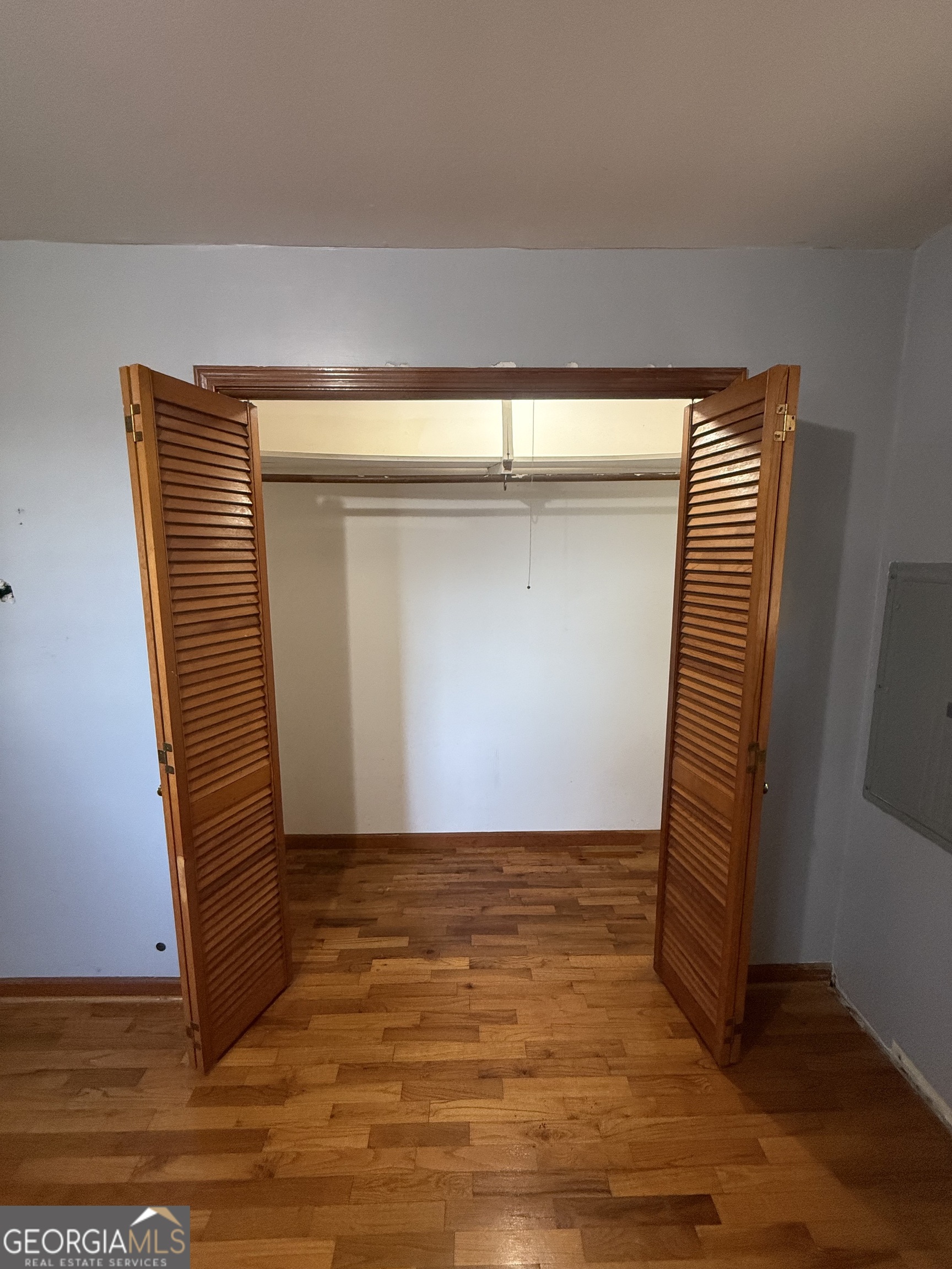 2068 Old Dalton Road Northeast Rome, GA 30165 - Photo 35 of 37 a view of an empty room with wooden floor