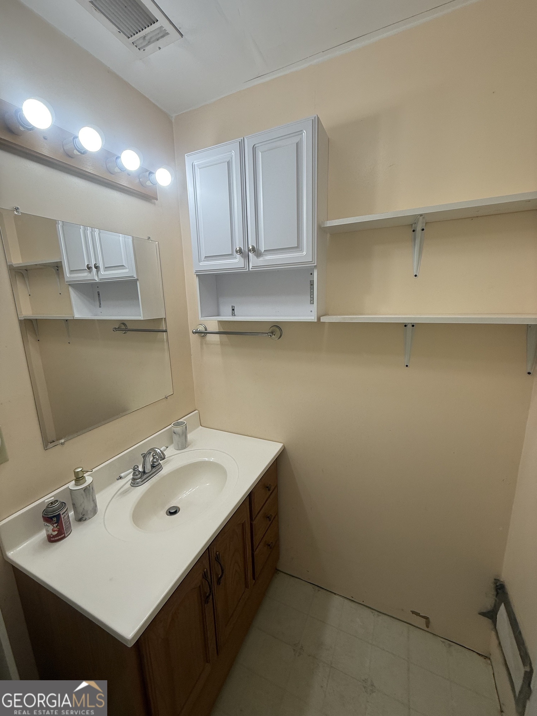 2068 Old Dalton Road Northeast Rome, GA 30165 - Photo 36 of 37 a bathroom with a sink and a mirror