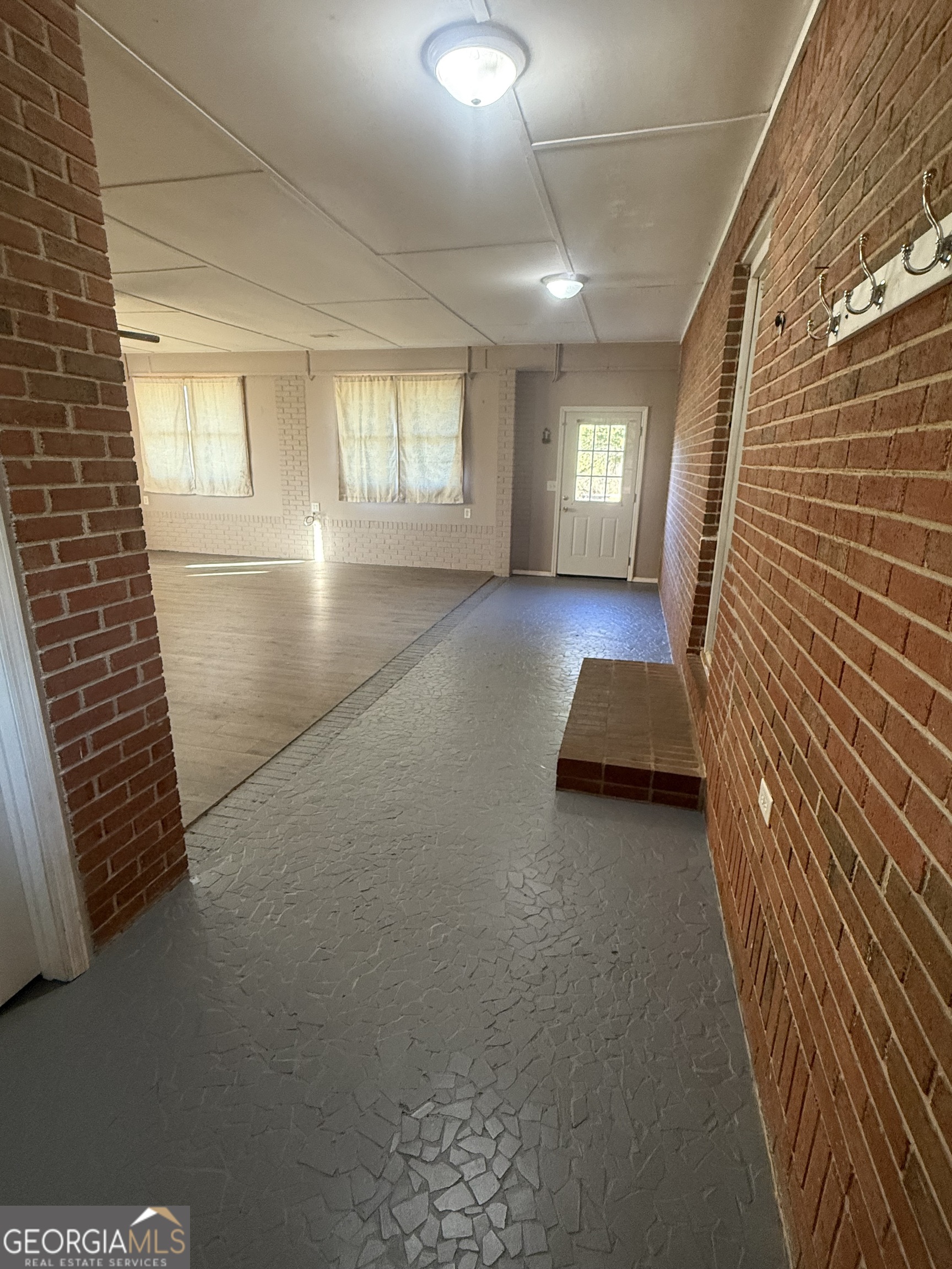 2068 Old Dalton Road Northeast Rome, GA 30165 - Photo 6 of 37 a view of a livingroom with wooden floor and furniture