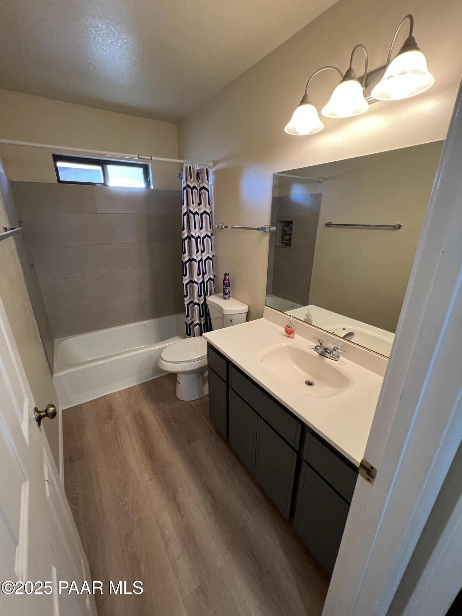 8860 East Yavapai Road, Unit C Prescott Valley, AZ 86314 - Photo 15 of 17 a bathroom with a sink and a mirror