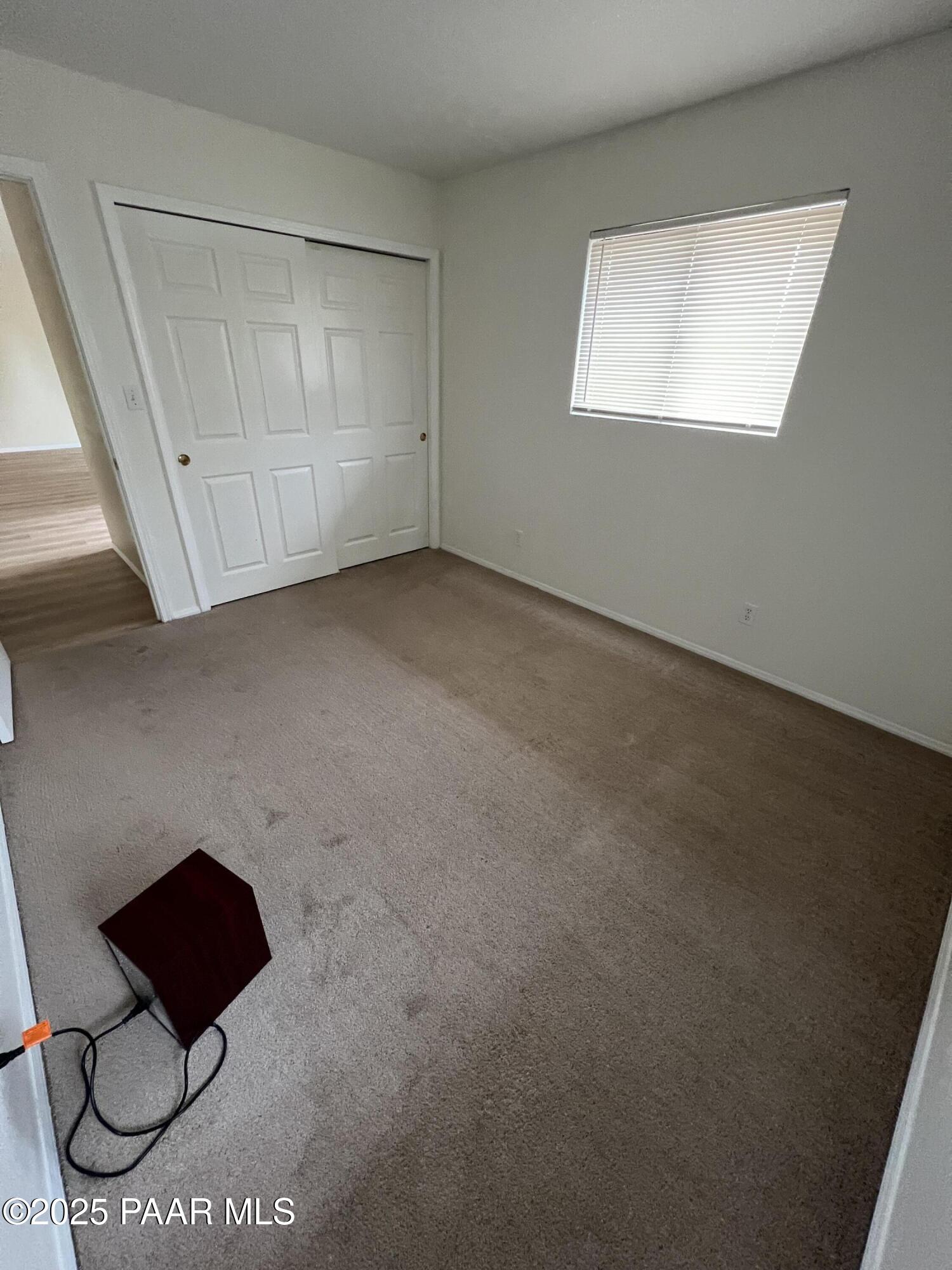 8860 East Yavapai Road, Unit C Prescott Valley, AZ 86314 - Photo 5 of 17 a view of an empty room and wooden floor