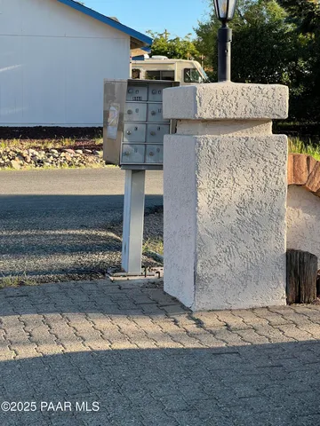 a view of car parked on street side of building