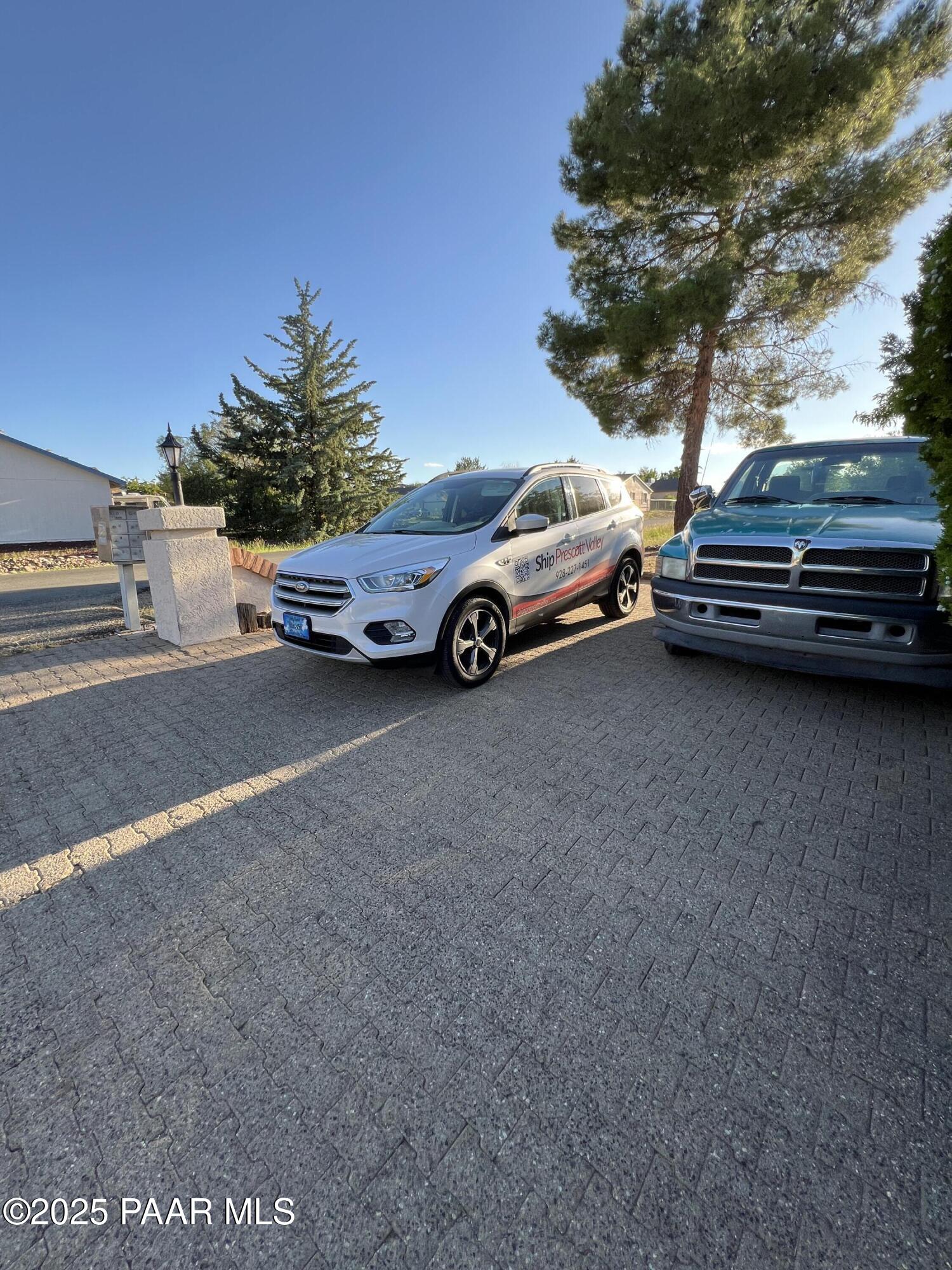 8860 East Yavapai Road, Unit C Prescott Valley, AZ 86314 - Photo 8 of 17 a view of car parked on street side of building