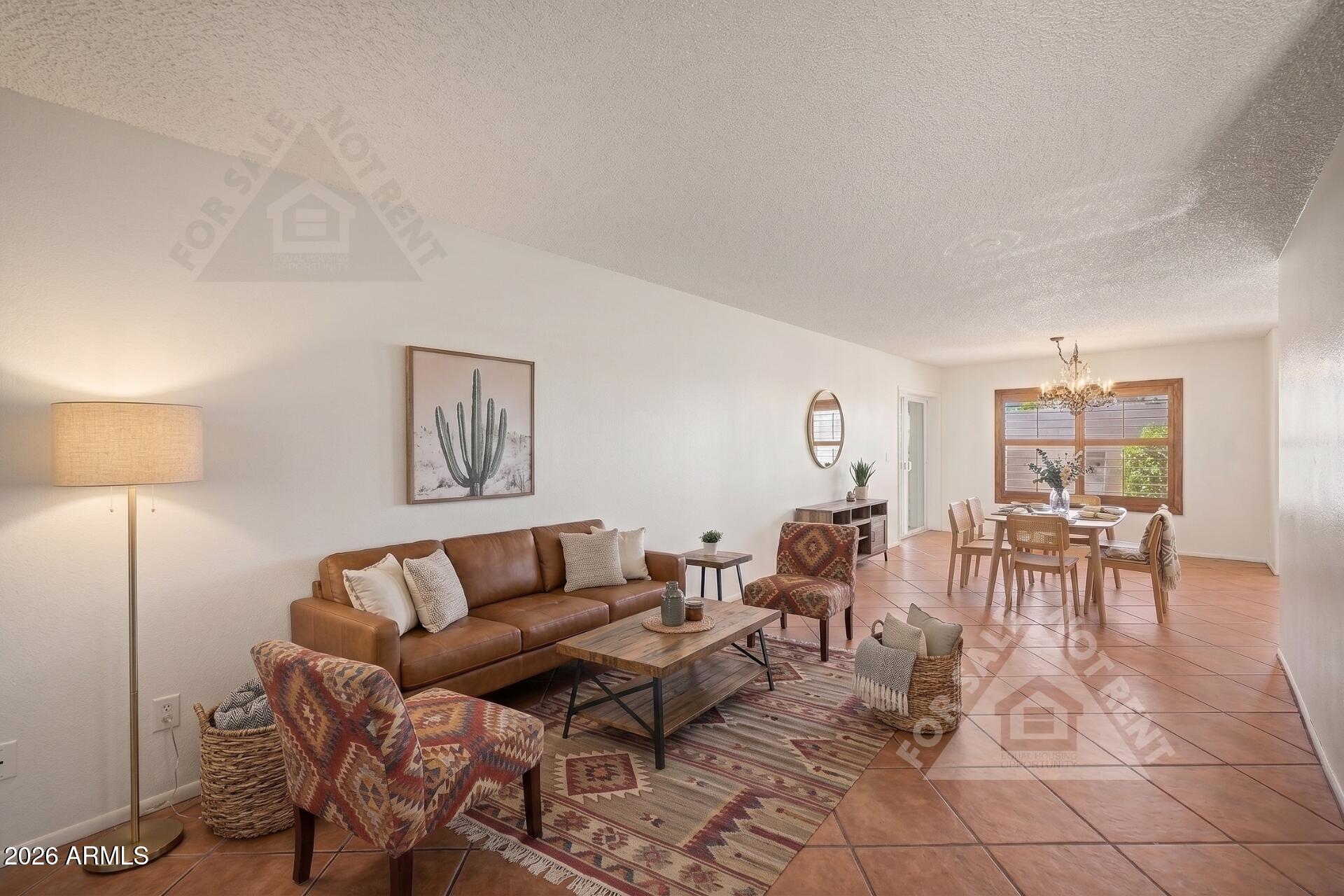 912 East Villa Rita Drive Phoenix, AZ 85022 - Photo 10 of 27 a living room with furniture a dining table and a lamp