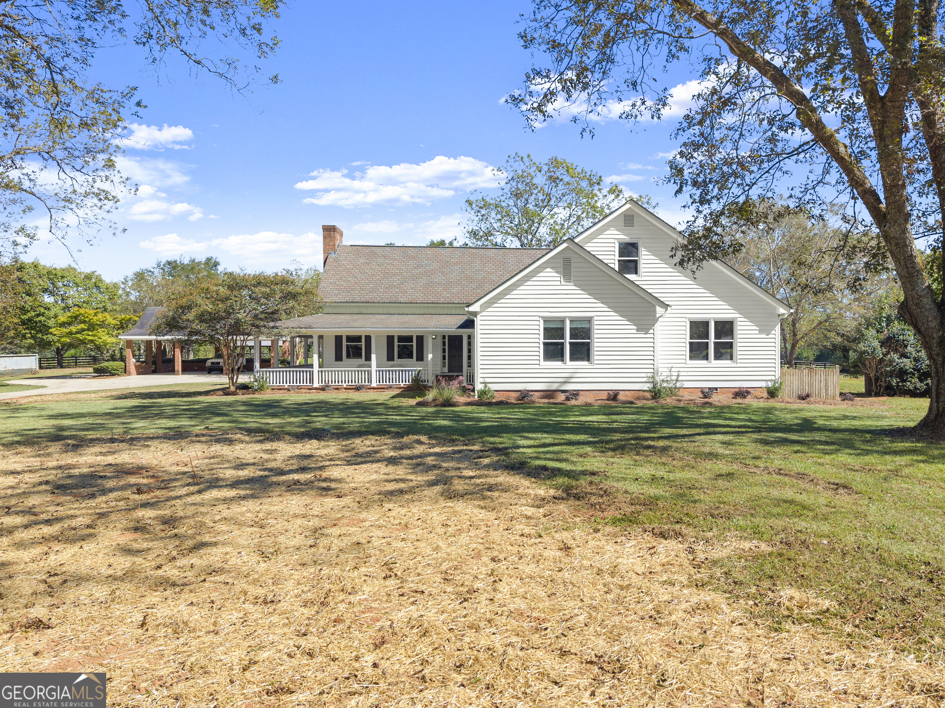1972 Rest Haven Road Yatesville, GA 31097 - Photo 3 of 52 a front view of a house with a garden
