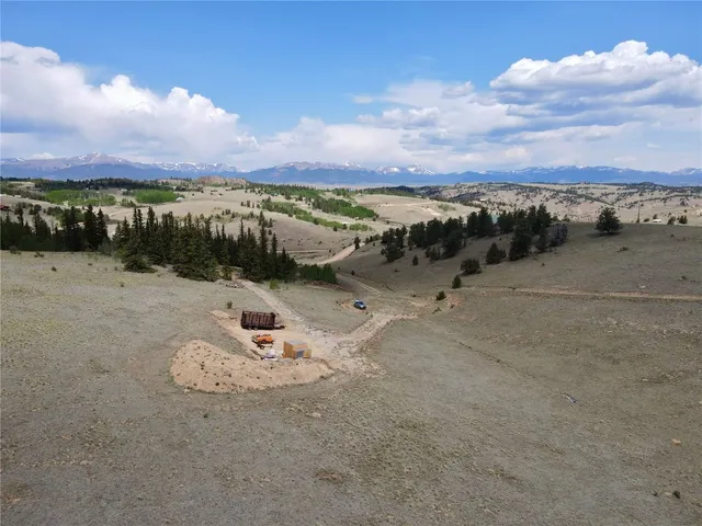 a view of a terrace with a table and chairs