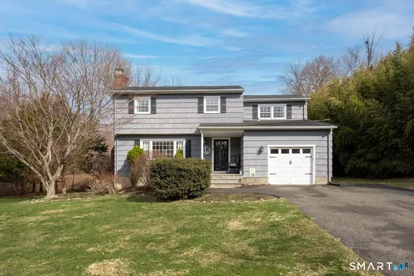 a house view with a garden space