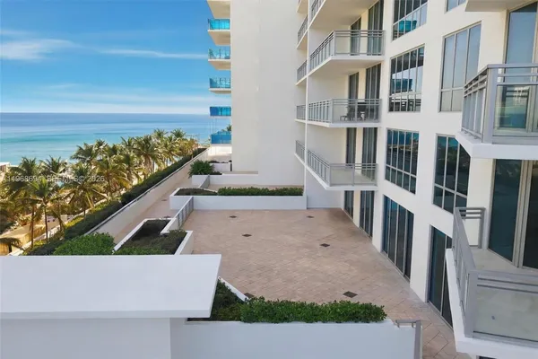 an aerial view of a house with outdoor space