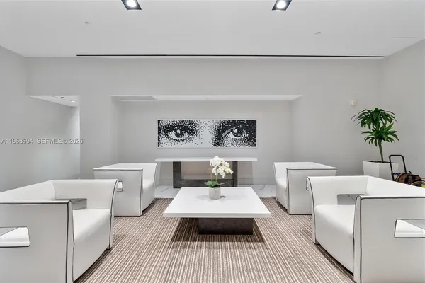a living room with furniture and a rug