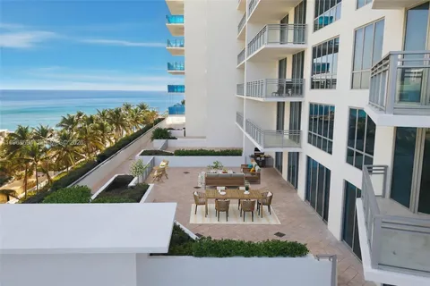 an aerial view of a house with outdoor space