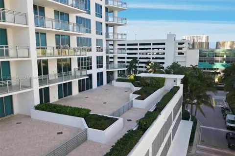 a view of building with yard and staircase