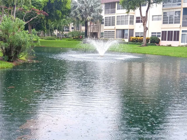 a view of building with river in front of it
