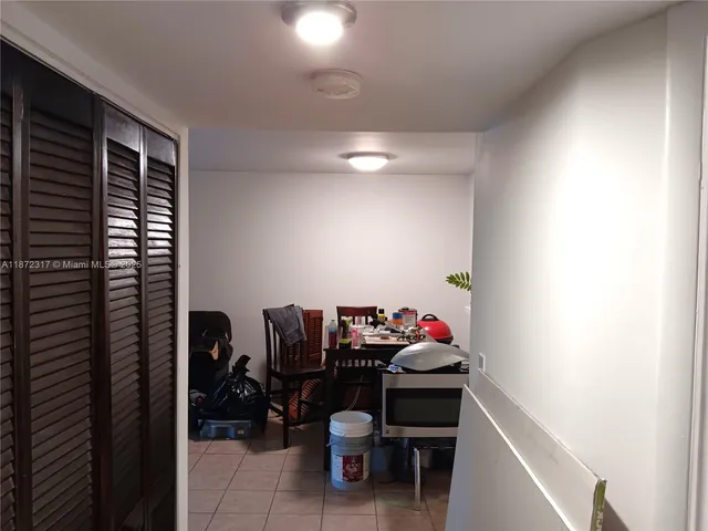 a living room with furniture and white walls