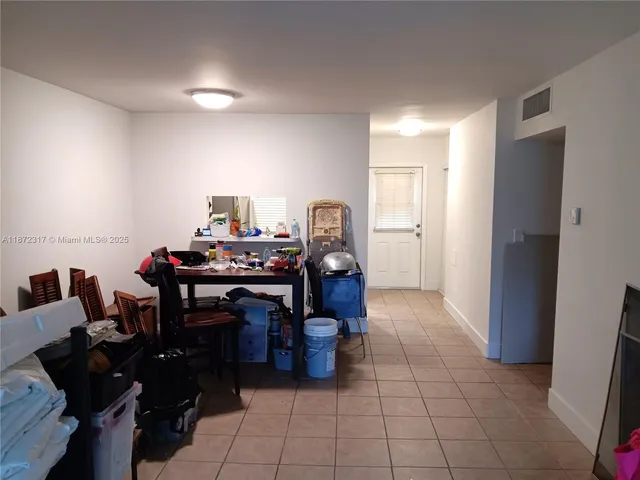 a view of a workspace with furniture