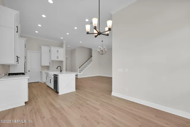 a view of a kitchen with a sink and dishwasher