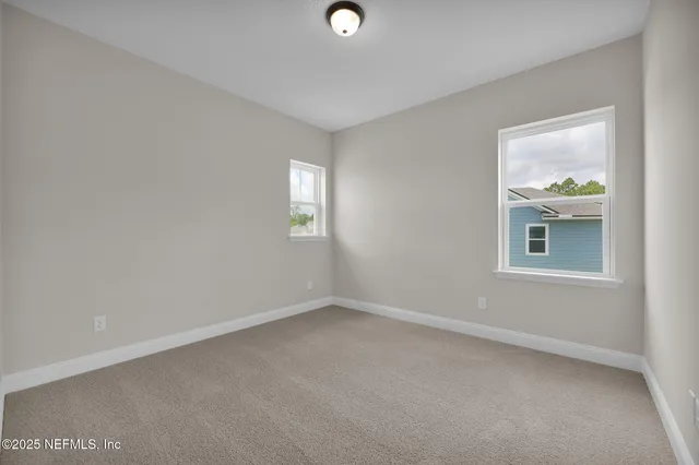 a view of an empty room with a balcony