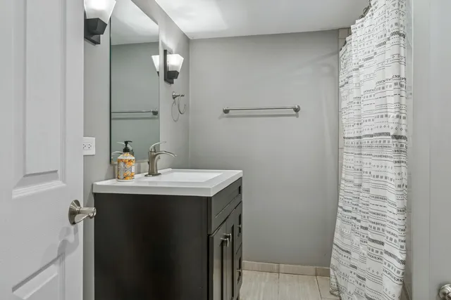 a bathroom with a sink and mirror