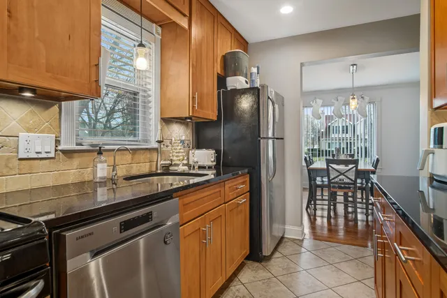 a kitchen with stainless steel appliances a refrigerator and a sink