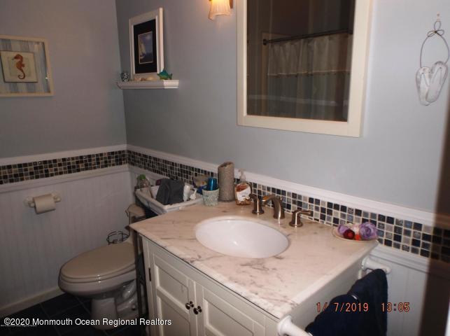 15 Main Avenue, Unit 2 Ocean Grove, NJ 07756 - Photo 5 of 15 a bathroom with a sink and a toilet