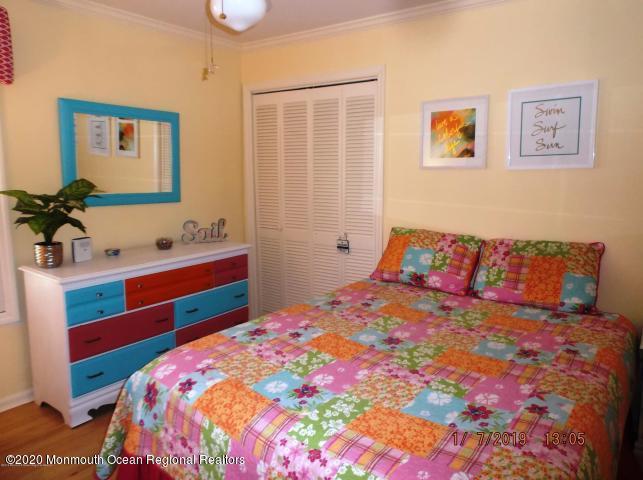 15 Main Avenue, Unit 2 Ocean Grove, NJ 07756 - Photo 6 of 15 a bedroom with a bed and a dresser