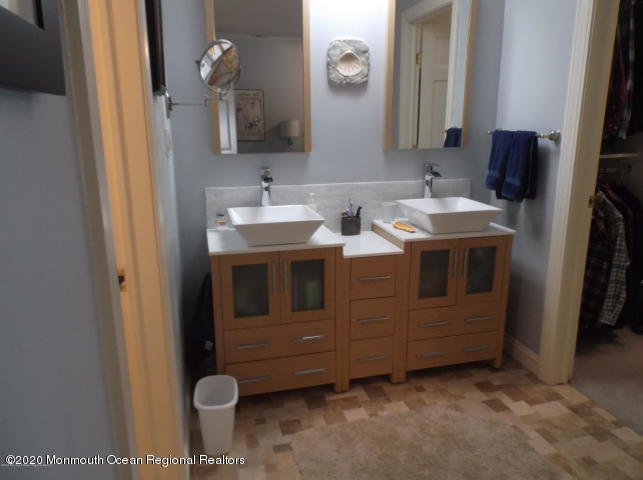 15 Main Avenue, Unit 2 Ocean Grove, NJ 07756 - Photo 8 of 15 a bathroom with a sink and a mirror