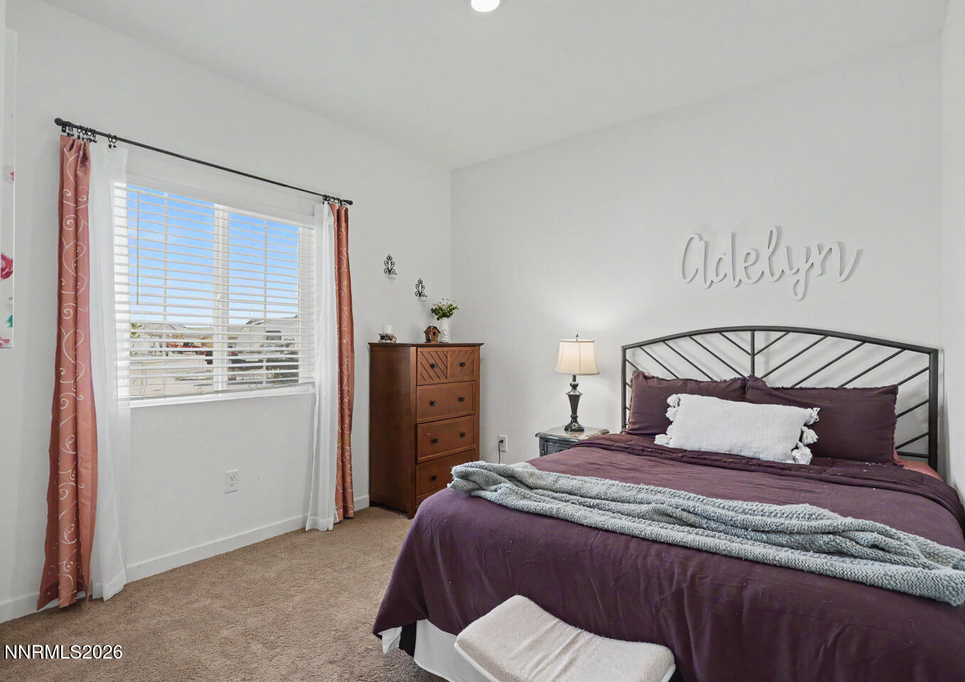 606 Sycamore Drive Fallon, NV 89406 - Photo 11 of 26 a bedroom with a bed and a window