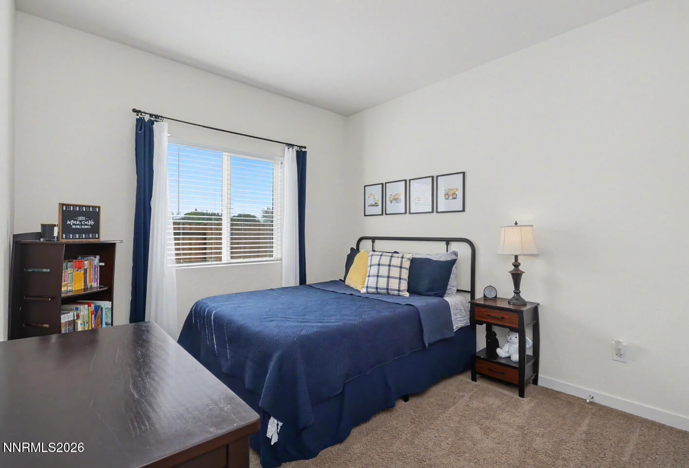 606 Sycamore Drive Fallon, NV 89406 - Photo 13 of 26 a bedroom with a bed and a tv on table