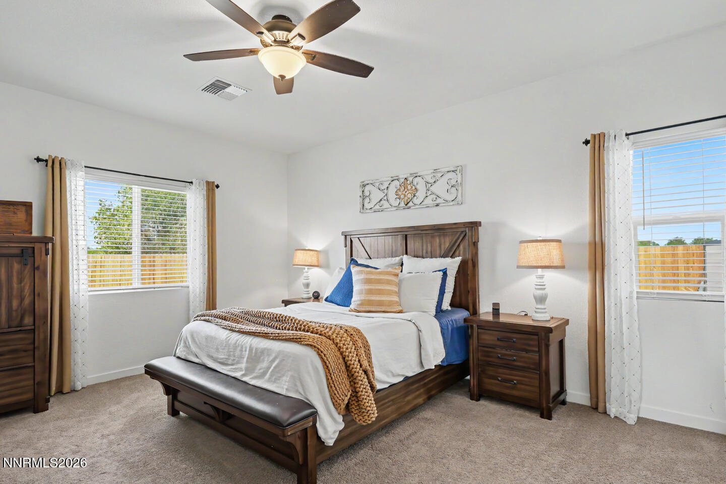 606 Sycamore Drive Fallon, NV 89406 - Photo 15 of 26 a bedroom with a bed and a window