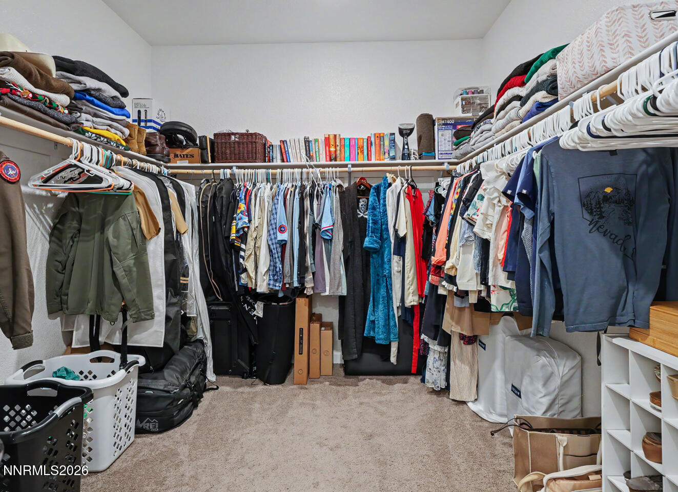 606 Sycamore Drive Fallon, NV 89406 - Photo 17 of 26 a view of walk in closet with clothes and shoes