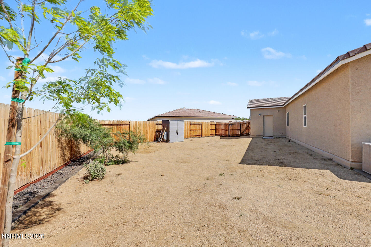 606 Sycamore Drive Fallon, NV 89406 - Photo 23 of 26 a view of a house with a yard