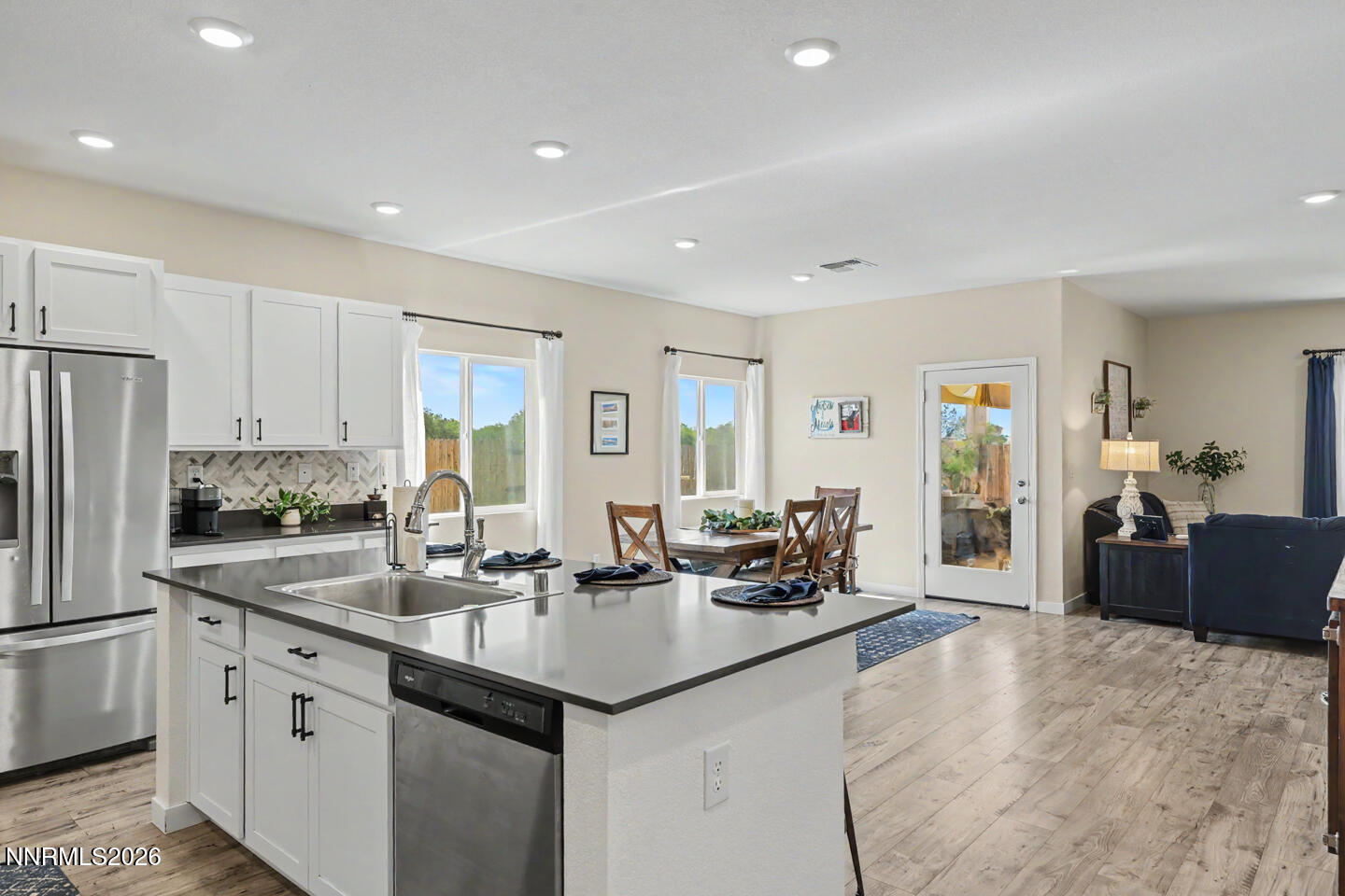606 Sycamore Drive Fallon, NV 89406 - Photo 7 of 26 a kitchen with granite countertop a sink and cabinets