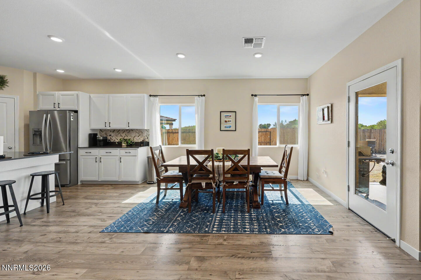 606 Sycamore Drive Fallon, NV 89406 - Photo 10 of 26 a view of a dining room with furniture and wooden floor