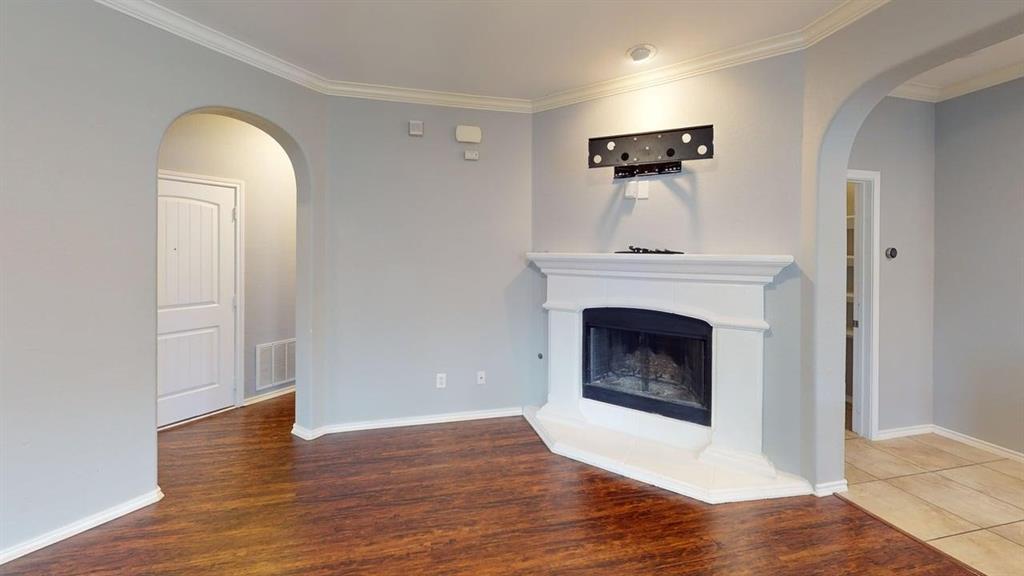 14308 Polo Ranch Street Fort Worth, TX 76052 - Photo 9 of 19 Corner fireplace with a substantial white mantel and hearth