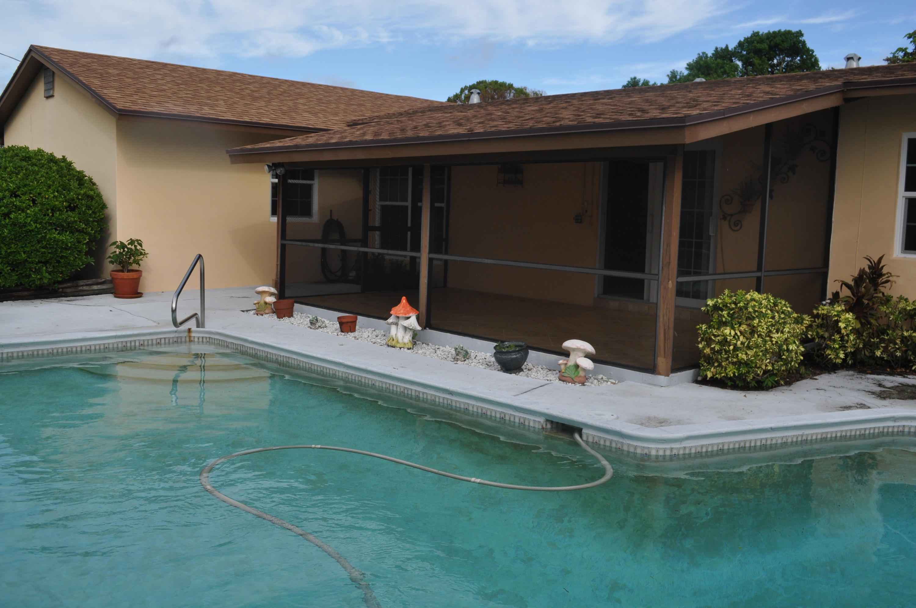 933 Firetree Road North Palm Beach, FL 33408 - Photo 3 of 16 Screened Patio