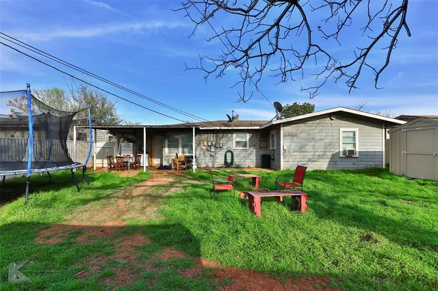 a backyard of a house with seating space