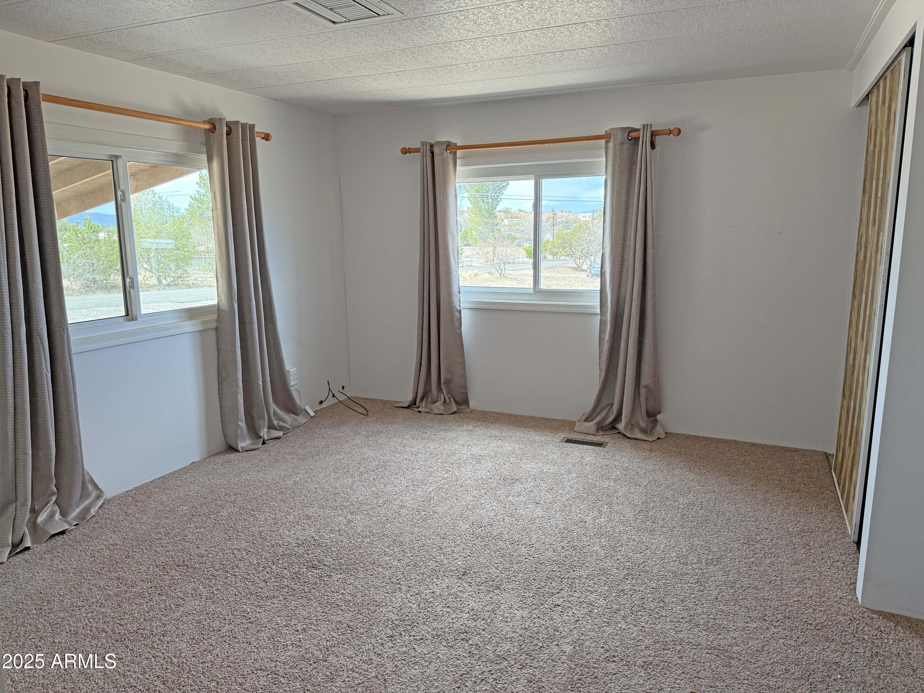 4715 North Drifting Sands Road Rimrock, AZ 86335 - Photo 14 of 39 an empty room with a window