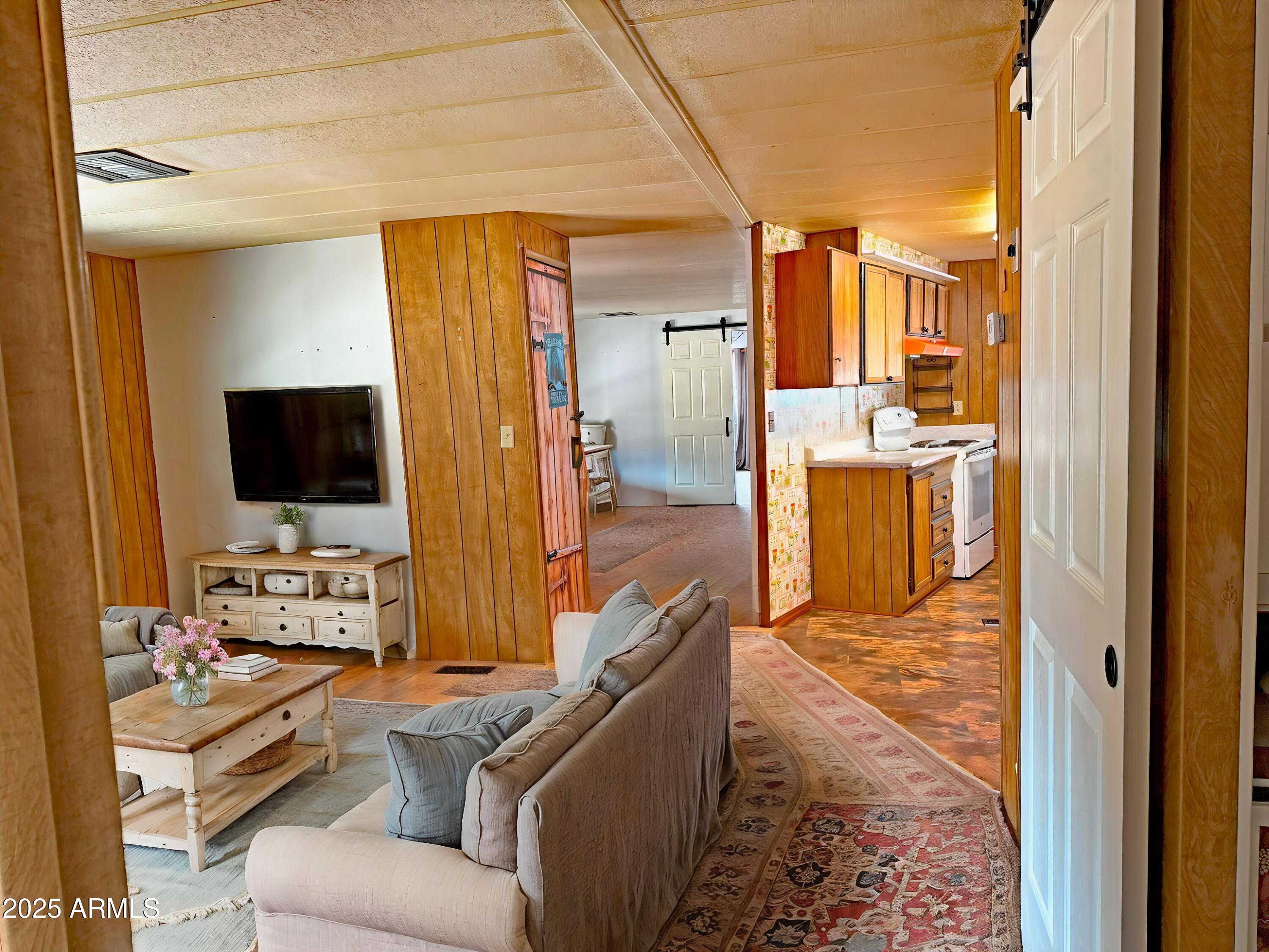 4715 North Drifting Sands Road Rimrock, AZ 86335 - Photo 27 of 39 a living room with furniture and a flat screen tv