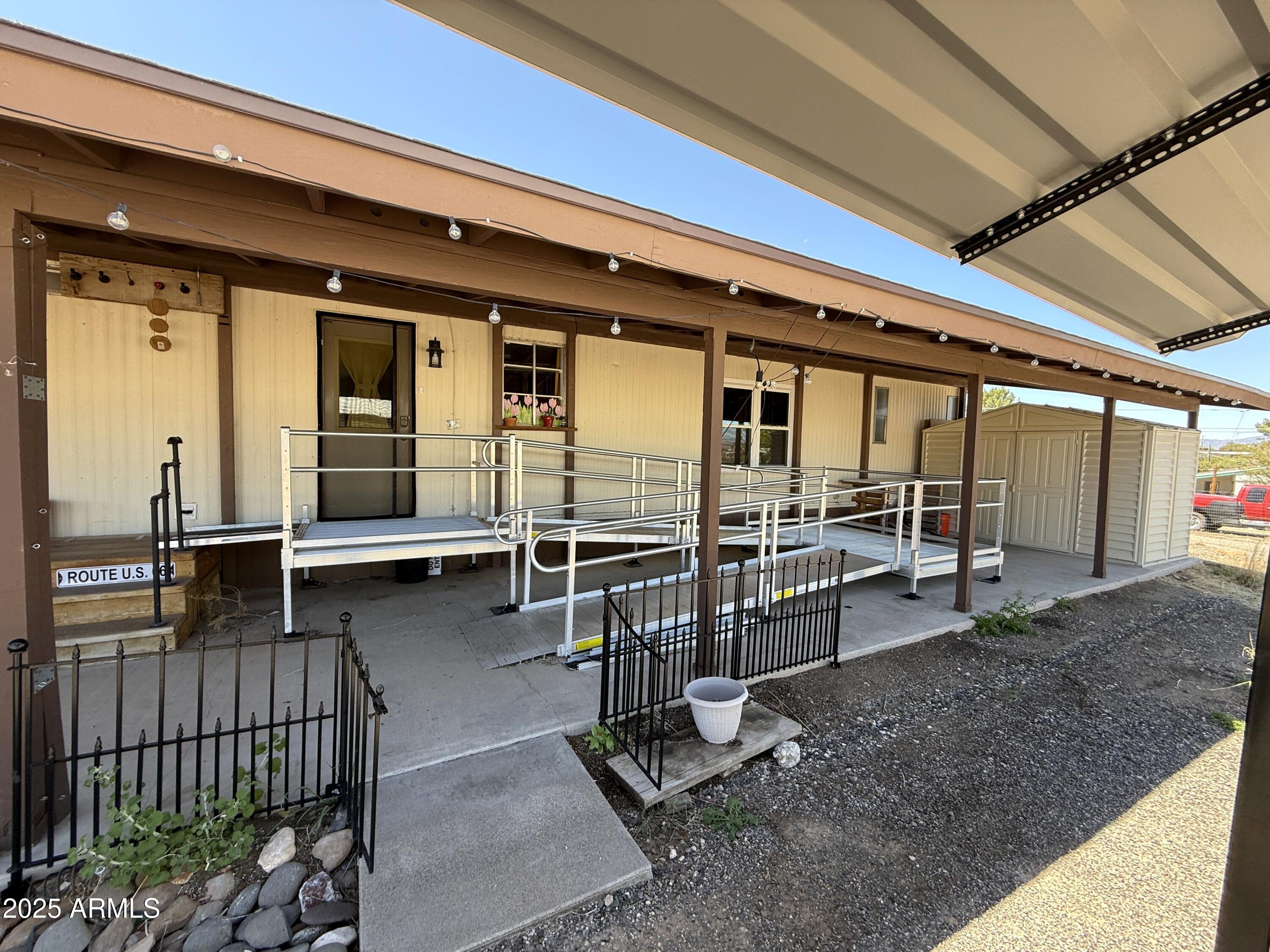 4715 North Drifting Sands Road Rimrock, AZ 86335 - Photo 29 of 39 a view of a porch with wooden floor and furniture