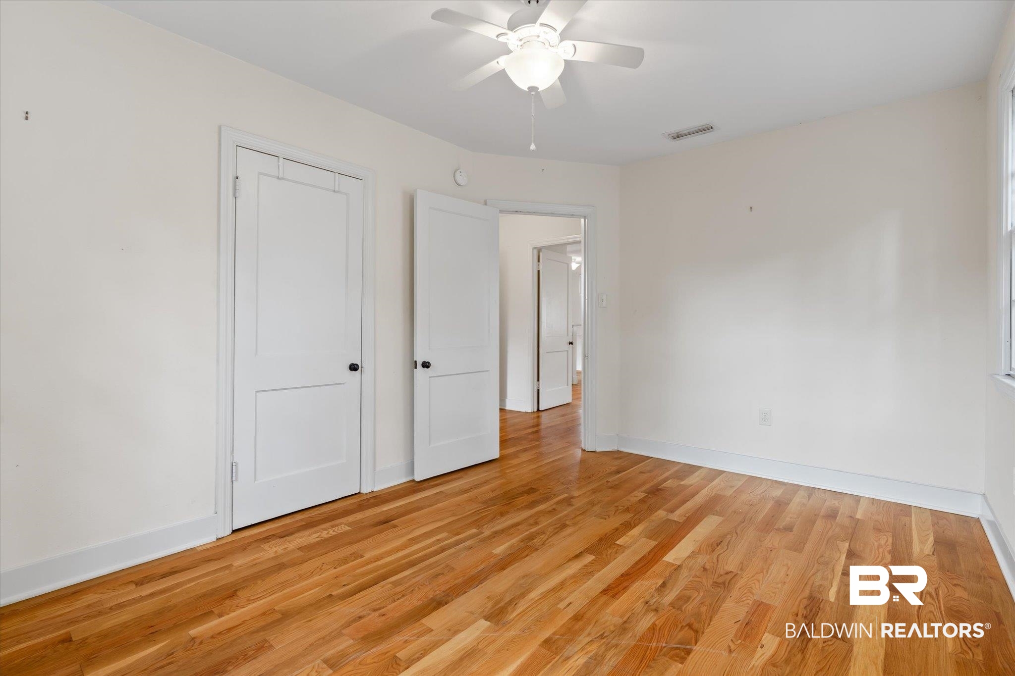 5113 Norton Lane Mobile, AL 36608 - Photo 11 of 20 Unfurnished bedroom featuring light hardwood / wood-style flooring and ceiling fan