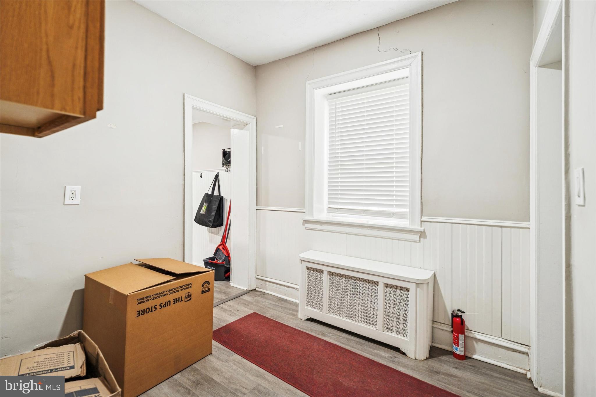 352 Carson Street Philadelphia, PA 19128 - Photo 11 of 35 a living room with furniture and a fireplace
